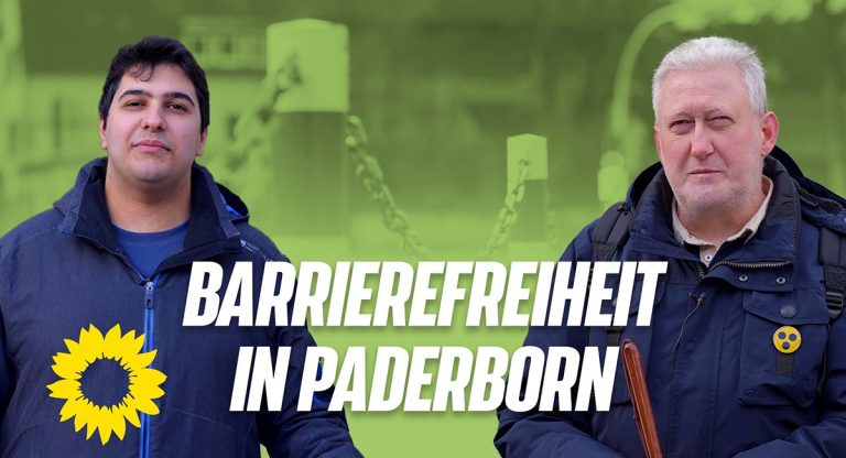 Ratsherr Güven Erkurt und Rüdiger Kühl werben für ein YouTube-Video zum Thema barrierefreies Paderborn.